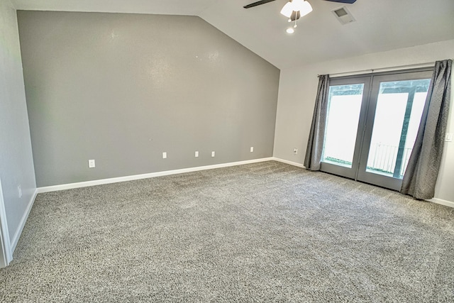 spare room with lofted ceiling, ceiling fan, and carpet