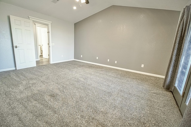 unfurnished bedroom with carpet floors, ceiling fan, and vaulted ceiling