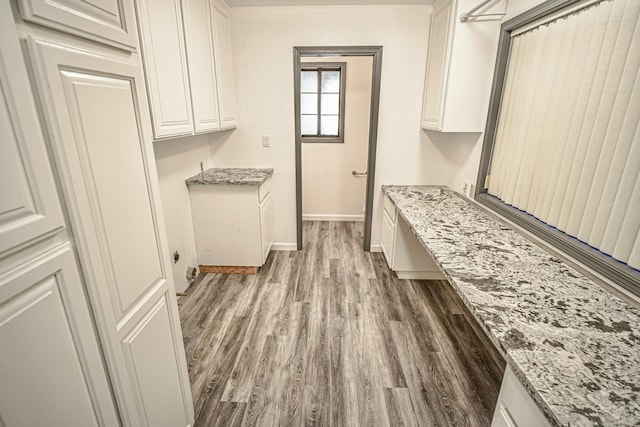 laundry room with hardwood / wood-style flooring