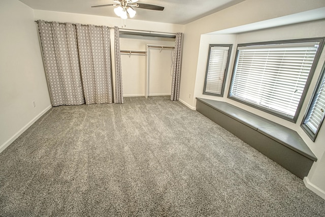 unfurnished bedroom featuring ceiling fan, a closet, and carpet floors