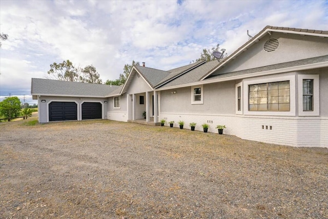 ranch-style house featuring a garage