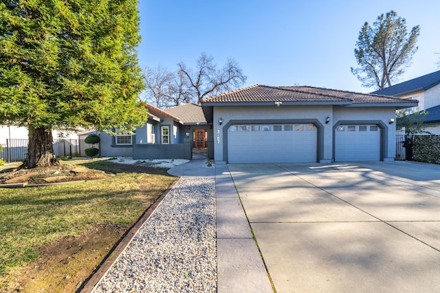 view of front of house with a garage and a front yard