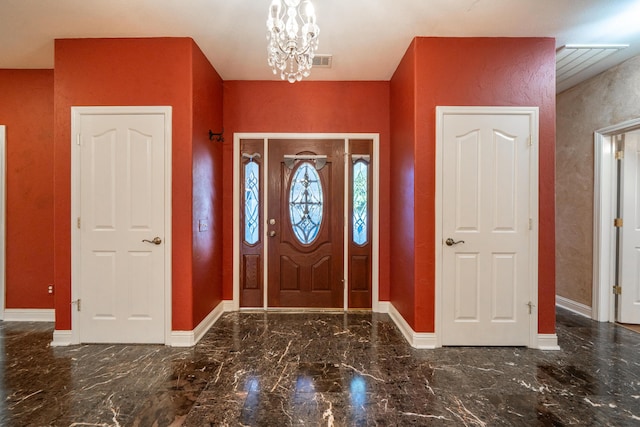 entryway featuring a chandelier