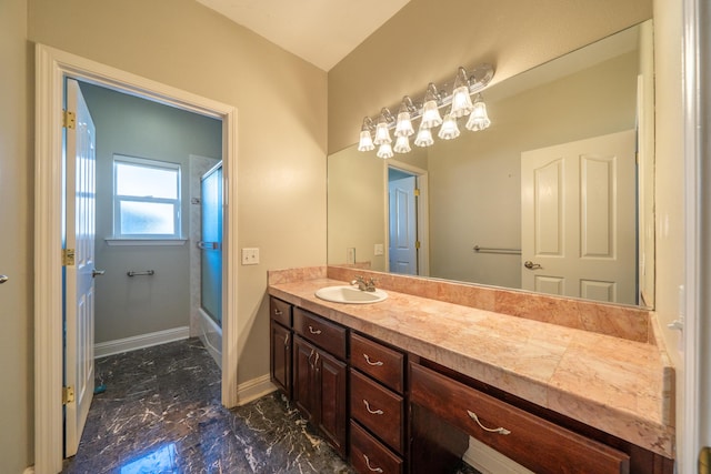 bathroom featuring vanity and bath / shower combo with glass door