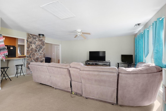 living room with light carpet and ceiling fan