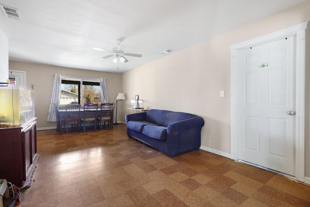 living room with ceiling fan