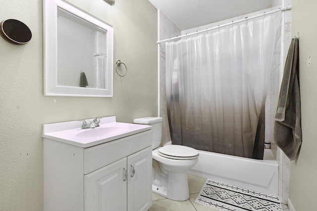 full bathroom with vanity, tile patterned floors, toilet, and shower / bath combo