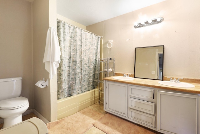 full bathroom with vanity, shower / tub combo with curtain, and toilet