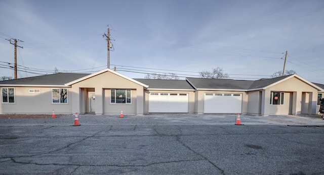 ranch-style home featuring a garage