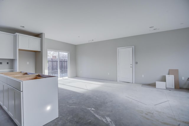 kitchen with white cabinets and a center island