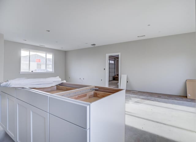 kitchen with white cabinets and a kitchen island