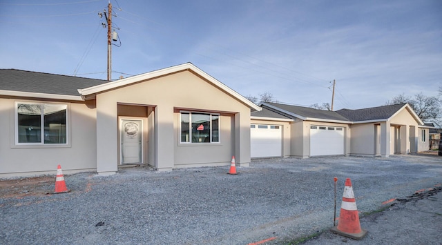 ranch-style home featuring a garage