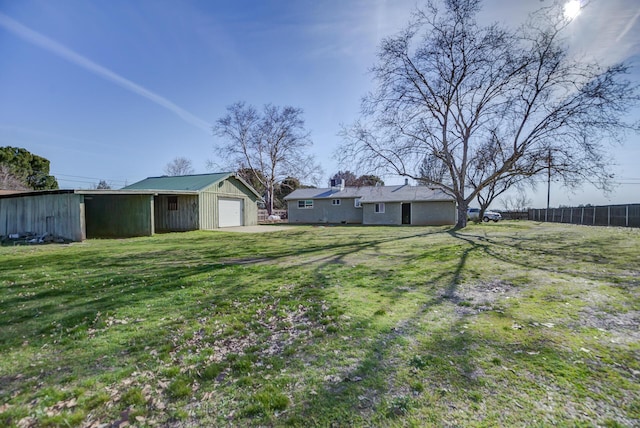 view of yard with an outbuilding and a garage