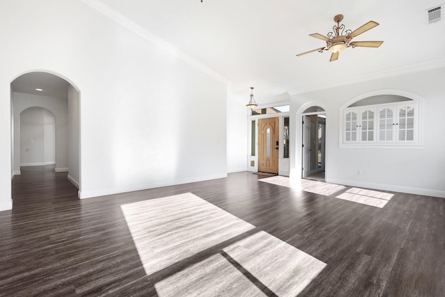 spare room with ornamental molding, dark hardwood / wood-style floors, and ceiling fan