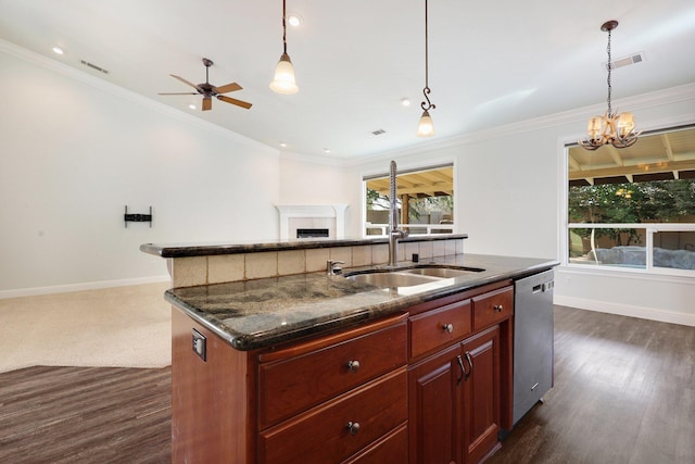 kitchen with sink, crown molding, an island with sink, and dishwasher