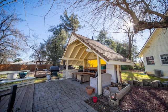 view of patio / terrace with central AC and a grill