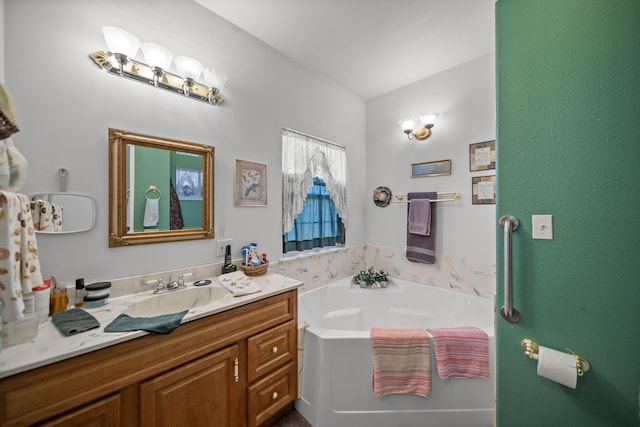 bathroom with vanity and a bathtub