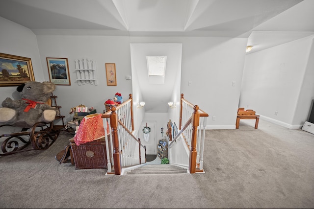 interior space featuring a skylight and carpet flooring