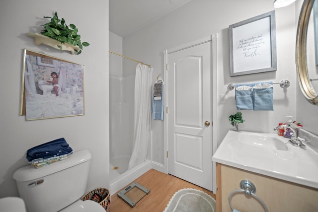 bathroom featuring hardwood / wood-style flooring, toilet, vanity, and a shower with shower curtain