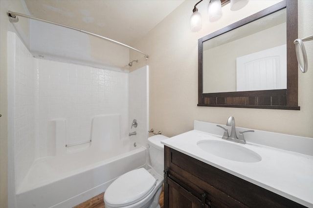 full bathroom featuring hardwood / wood-style flooring, shower / tub combination, vanity, and toilet