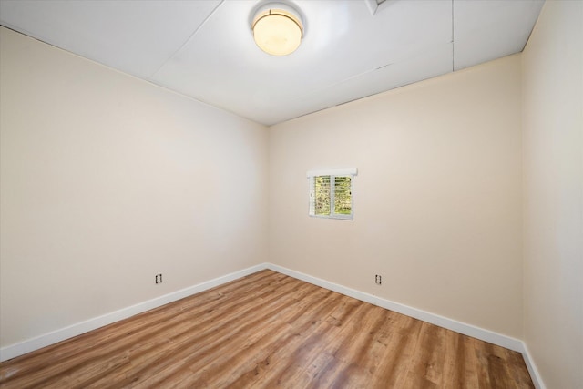 unfurnished room with wood-type flooring