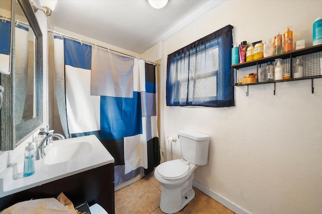 bathroom featuring vanity, walk in shower, tile patterned floors, and toilet