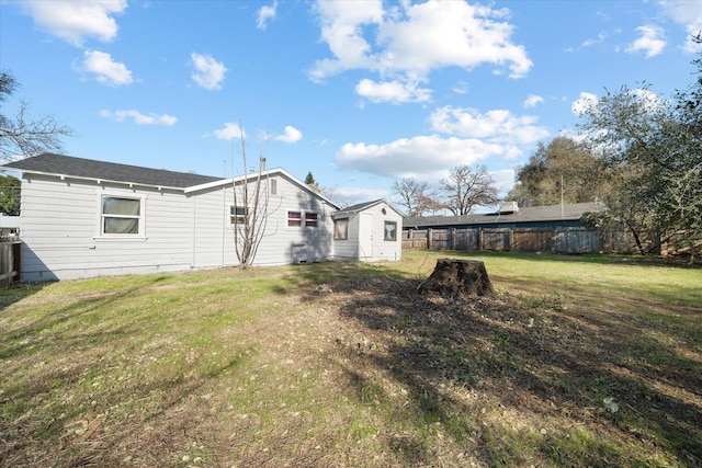 back of property with a lawn