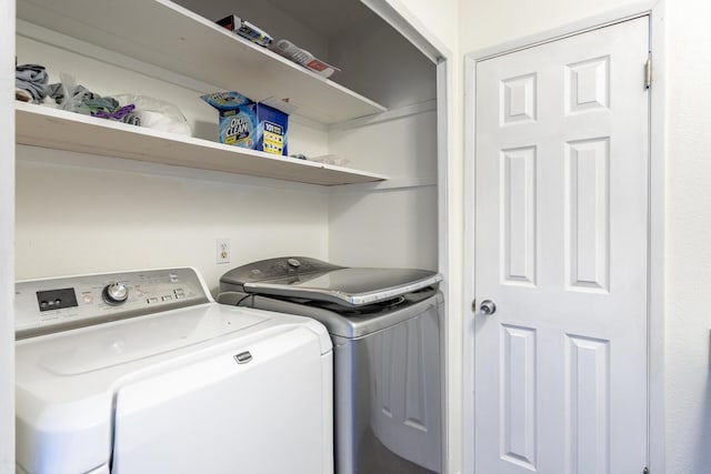 laundry room featuring washing machine and clothes dryer