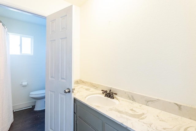 bathroom with vanity and toilet