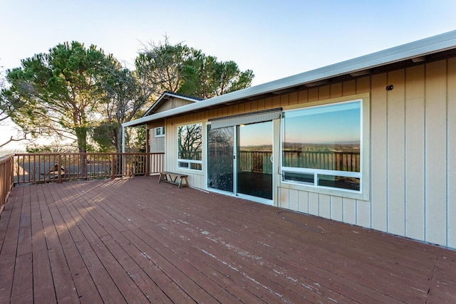 wooden terrace featuring a water view