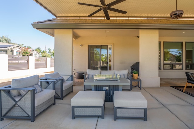 view of patio / terrace with ceiling fan and an outdoor living space