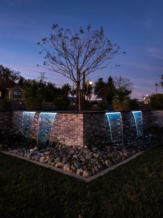 exterior space with pool water feature