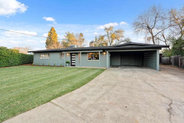 ranch-style house featuring a carport and a front lawn