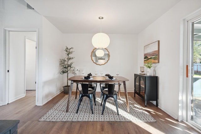 dining area featuring hardwood / wood-style floors