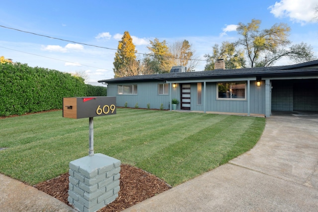 single story home featuring a front lawn