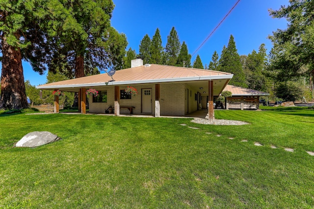 rear view of house with a lawn