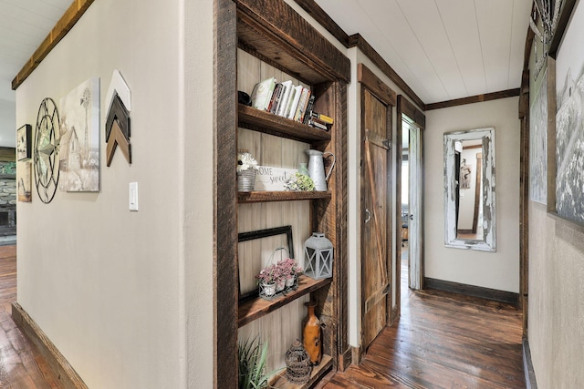 hall featuring crown molding and dark hardwood / wood-style floors