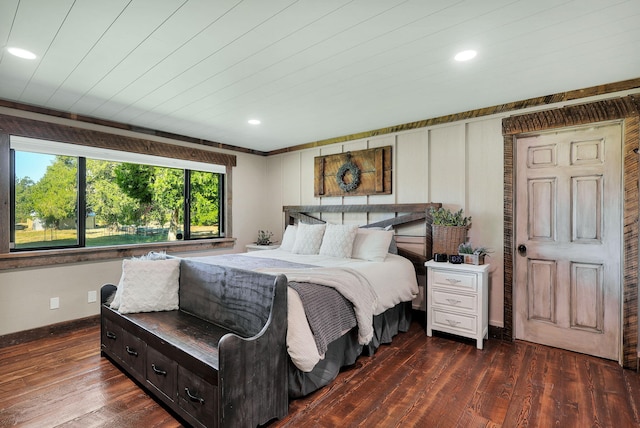 bedroom with dark wood-type flooring