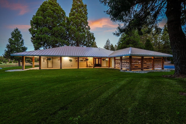 view of front of property with a yard