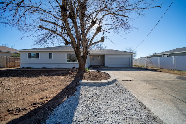 ranch-style home featuring a garage