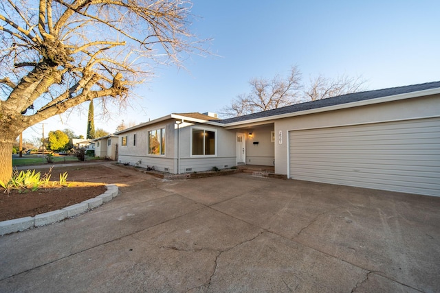 ranch-style home with a garage