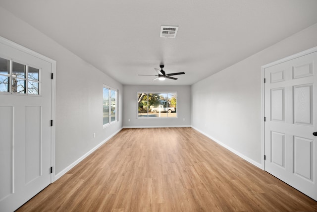 unfurnished living room with ceiling fan and light hardwood / wood-style flooring