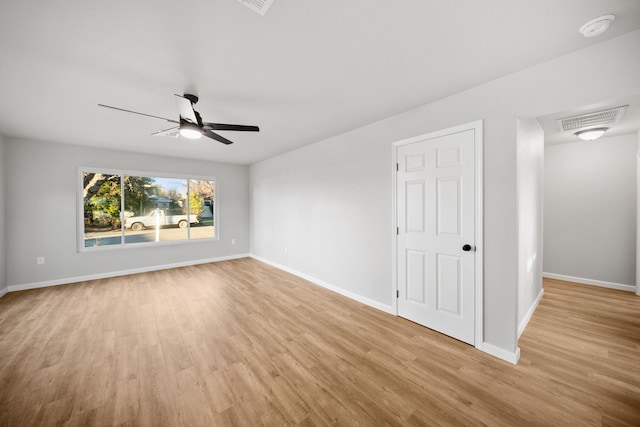 empty room featuring ceiling fan and light wood-type flooring