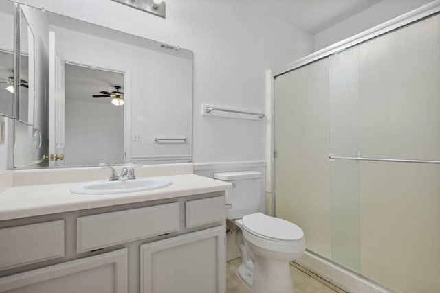 full bath featuring visible vents, toilet, ceiling fan, vanity, and a shower stall