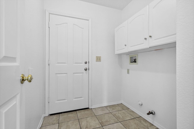 washroom featuring washer hookup, cabinet space, light tile patterned flooring, gas dryer hookup, and baseboards