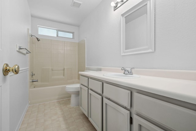 bathroom with toilet, bathtub / shower combination, visible vents, and vanity