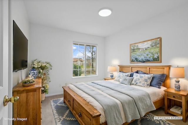 bedroom featuring carpet floors and baseboards