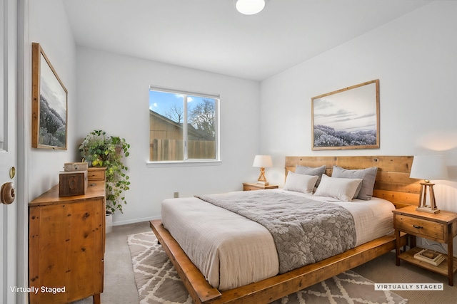 carpeted bedroom featuring baseboards