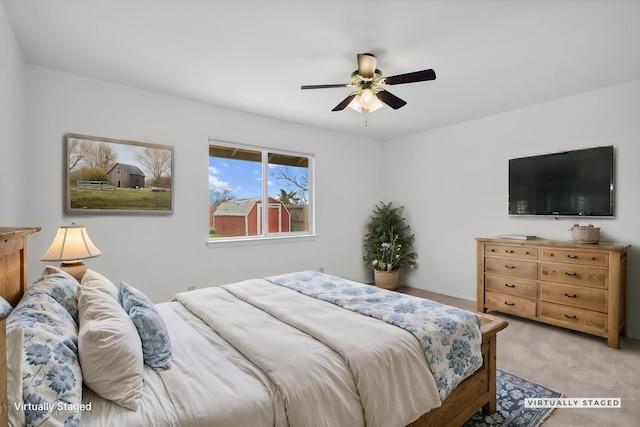 carpeted bedroom featuring a ceiling fan