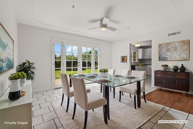 dining area with visible vents, french doors, ceiling fan, and light tile patterned floors